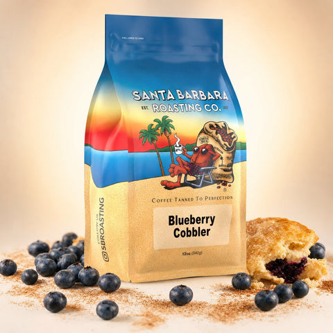 Blueberry Cobbler flavored coffee bag with fresh blueberries and a slice of cobbler