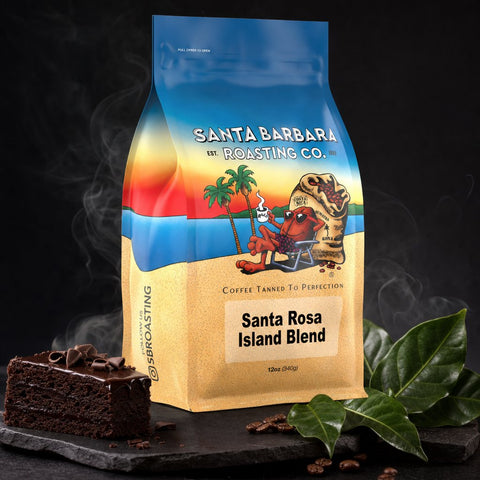 Santa Rosa Island Blend Naturally Grown coffee bag with a slice of chocolate cake and green leaves