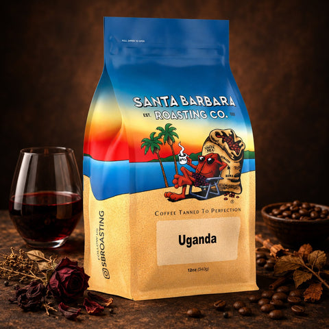 Uganda coffee bag with a glass of red wine and dark berries