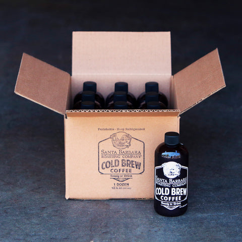 Case of bottled cold brew coffee with two bottles beside the open box