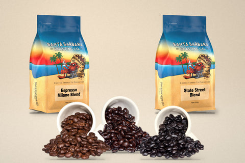 RoCo coffee beans from light to dark roast spilling from three espresso cups, in front of Espresso Milano and State Street Blend bags